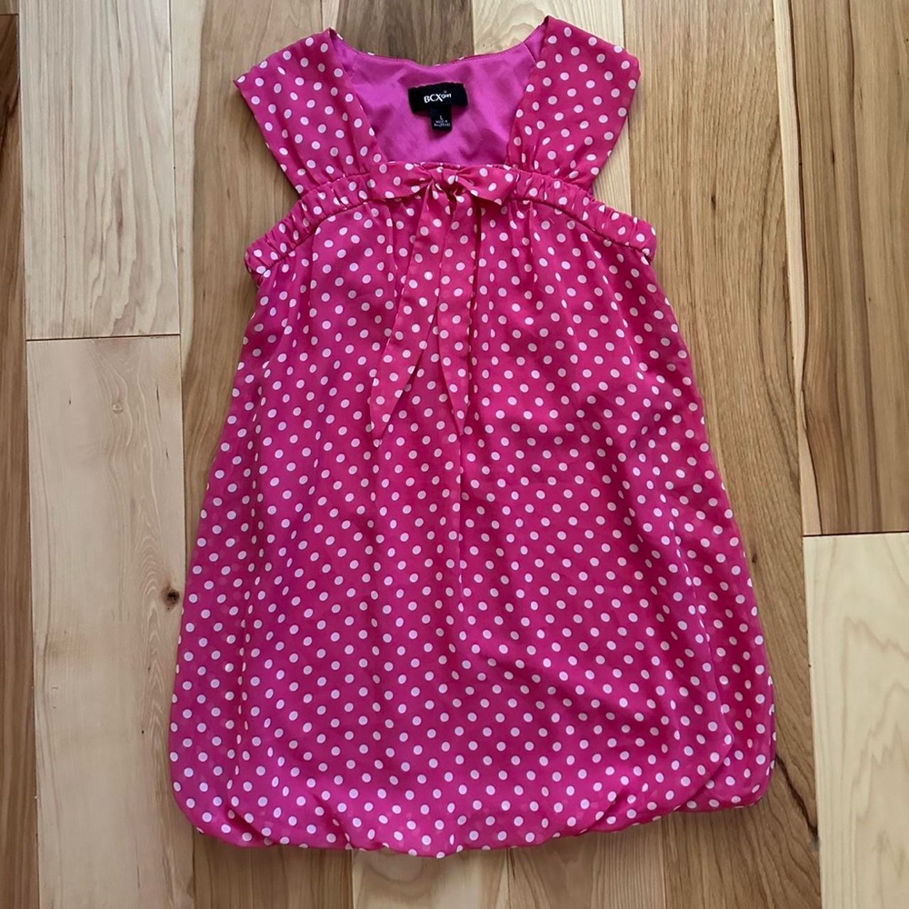 Pink and white polka dot top with bow detail
